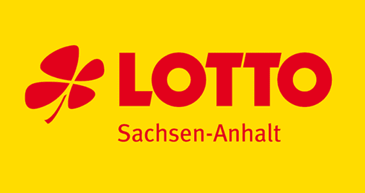 Logo von LOTTO Sachsen-Anhalt auf gelbem Hintergrund, bestehend aus einem vierblättrigen Kleeblatt und dem Schriftzug.