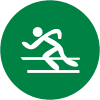 Piktogramm eines laufenden Athleten auf grünem Hintergrund in einem runden Format.